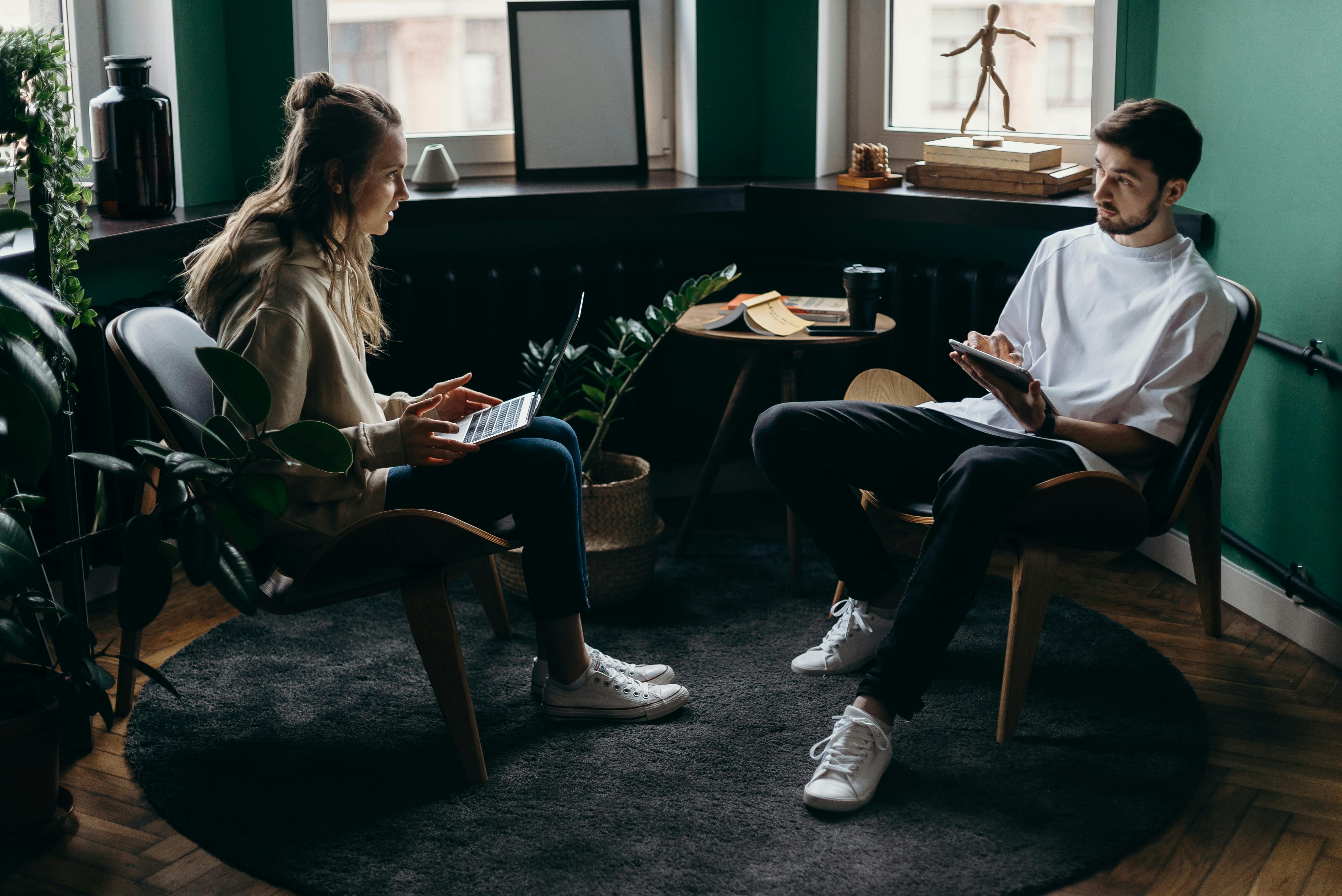 Man and woman eagerly discussing