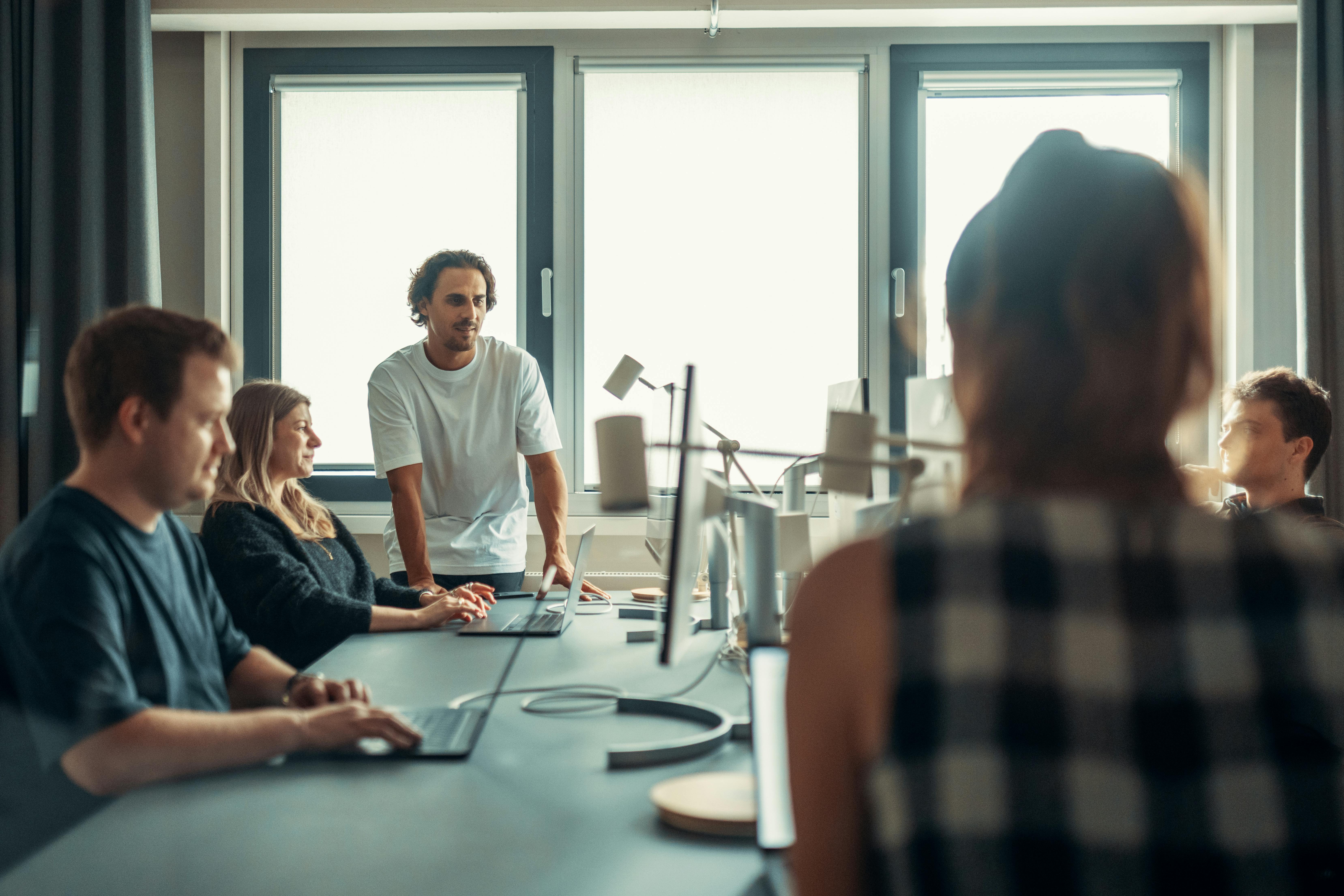 people in a team meeting having a discussion